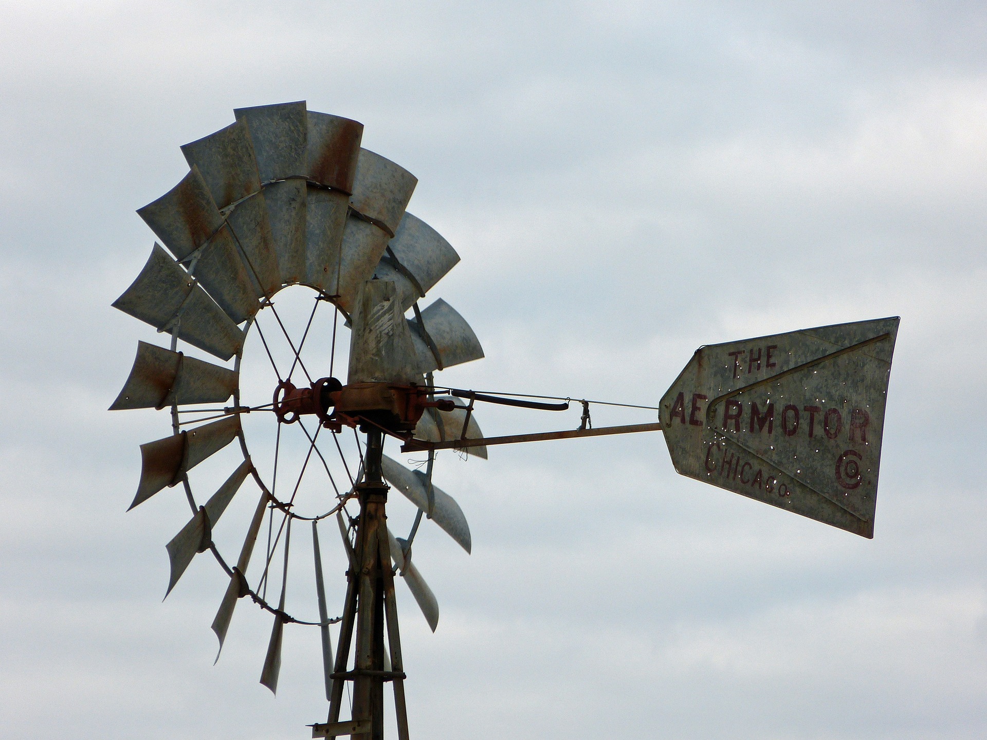 West Texas windmill standing in an open field at golden hour